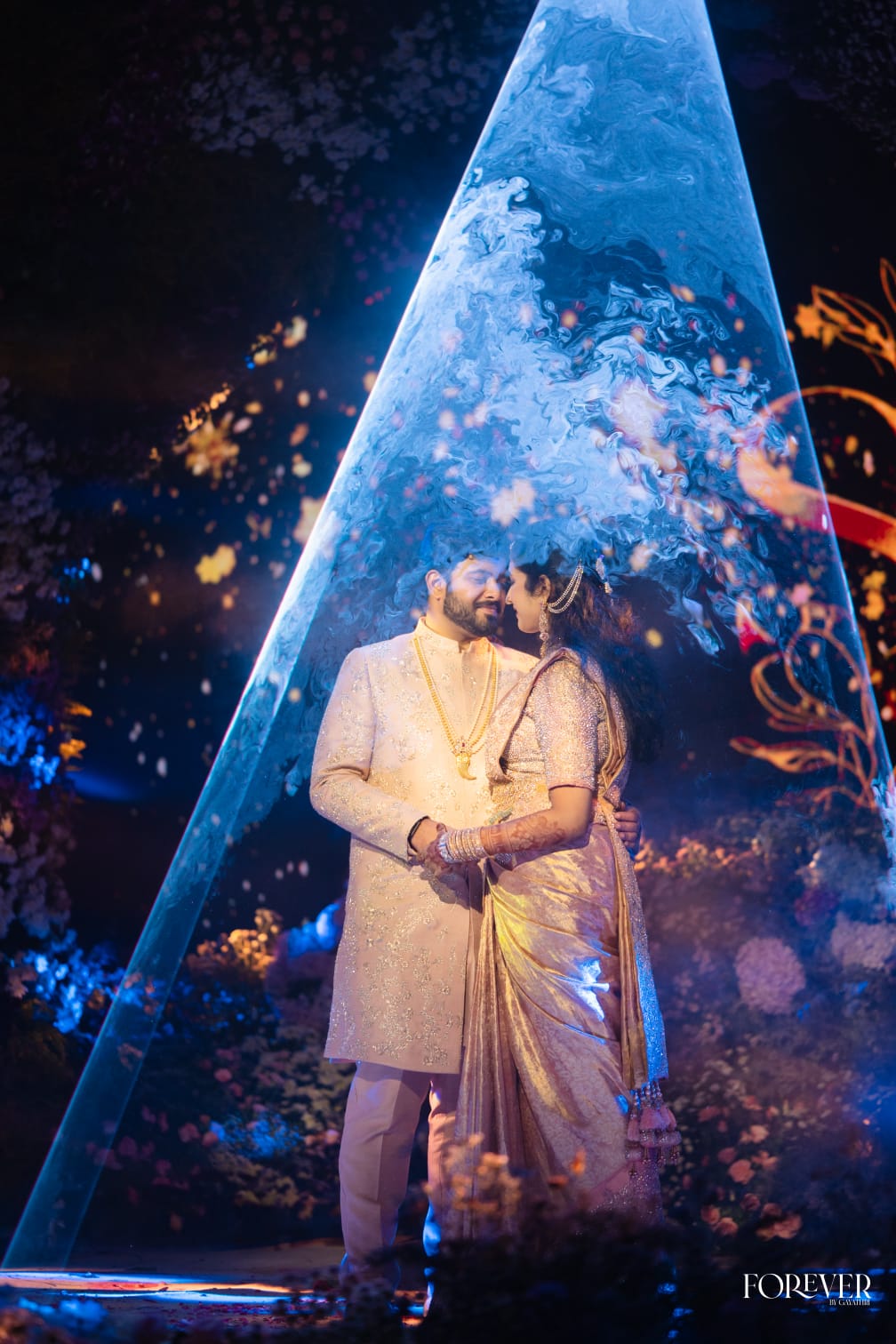 The couple beneath a marbled arch of light